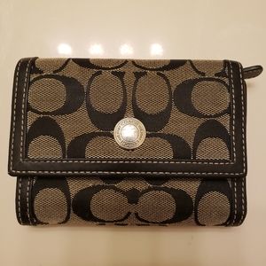 Coach small trifold wallet in signature canvas